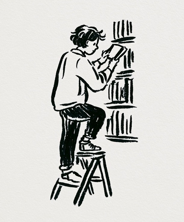 A student on a step stool pulling a book from a full shelf